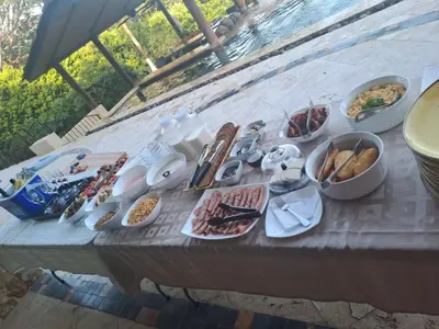 a table with a bunch of food on it at Villa Buena Onda All Inclusive in Coco