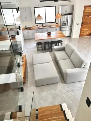 a living room with a white couch and a table at Casa María - Playa hermosa Cóbano in Playa hermosa