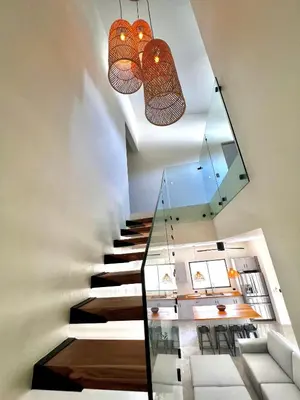 a staircase in a house with a glass floor at Casa María - Playa hermosa Cóbano in Playa hermosa