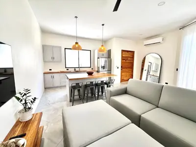 a living room with a couch and a table at Casa María - Playa hermosa Cóbano in Playa hermosa