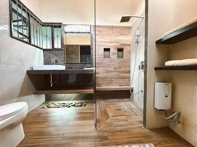 a bathroom with a shower and a toilet and a sink at Trébol House in Cuatro Esquinas