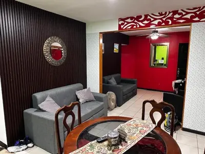 a living room with a couch and a table at Verde y Mar in Herradura