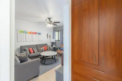 a living room with a couch and a table at Aqua Vista Ground Condo in Coco
