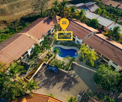 an overhead view of a house with a swimming pool at Aqua Vista Ground Condo in Coco