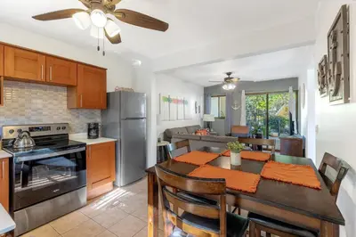 a kitchen and dining room with a table and a dining room at Aqua Vista Ground Condo in Coco