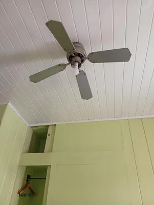 a ceiling fan hanging from a ceiling at Manuel Antonio rooms in Quepos