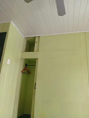 a ceiling in a room with a closet at Manuel Antonio rooms in Quepos