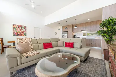 a living room with a couch and a coffee table at The Enclave D9 in Playa Avellana