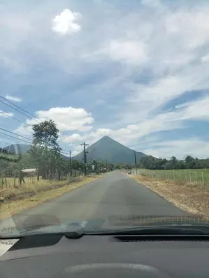 a view of a road with a mountain in the distance at Aqua Heaven in Jabillos