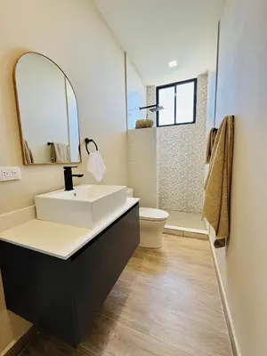a bathroom with a white sink and a mirror at Coco Rica Luxury Oceanview Villa Pool Concierge 4 Bedroom 6BED 5BA Playa Carrillo in Carrillo