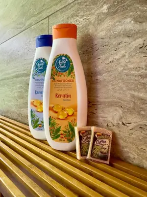 two bottles of detergent and a container of ketchup and a carton at Jungle Bungalow at Oropel Lodge in Puerto Viejo