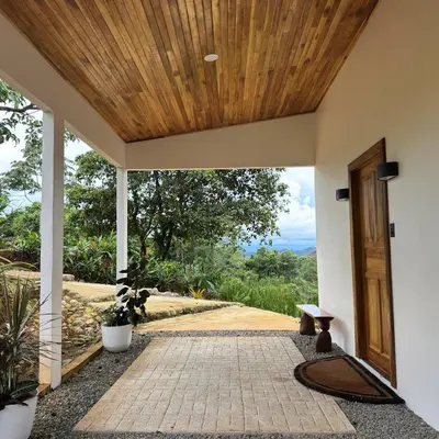 an entrance to a house with a wooden ceiling at Jungle Bungalow at Oropel Lodge in Puerto Viejo
