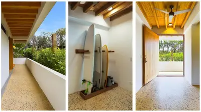 two images of a hallway with surfboards on the wall at Casa Cadejo- Incredible Surf House In Playa Grande in Playa Grande
