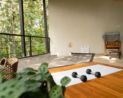 a room with a bed with weights on the floor at Vacation Rental Montezuma - 3BD, 3BA, Sleeps 8 in Delicias