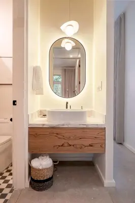 a bathroom with a sink and a mirror at Om at Namaste Oasis Condo in Nosara