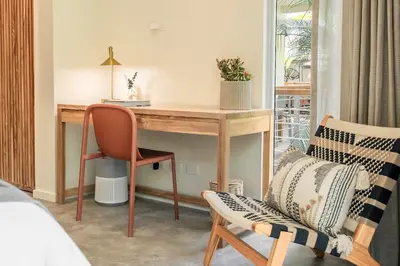 a bedroom with a desk and a chair at Prana at Namaste Oasis Condo in Nosara