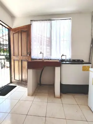 a kitchen with a sink and a window at Casa Chika, Playa Grande Guanacaste, Casa Completa in Cuajiniquil