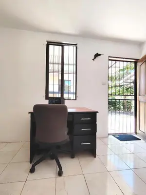 an office with a desk and a chair in a room at Casa Chika, Playa Grande Guanacaste, Casa Completa in Cuajiniquil