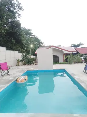 a blue swimming pool with a toy in the water at Casa Chika, Playa Grande Guanacaste, Casa Completa in Cuajiniquil