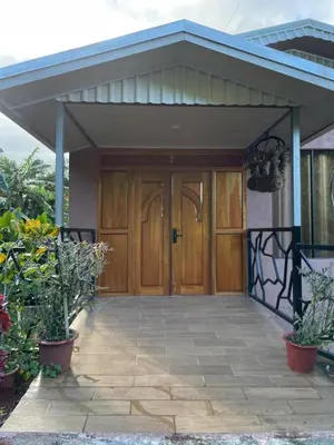 a house with a wooden door and a patio at San Gabriel Kalyäkä No 02 in San Gabriel