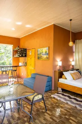 a room with a bed and a couch and a table at San Gabriel Kalyäkä No 02 in San Gabriel