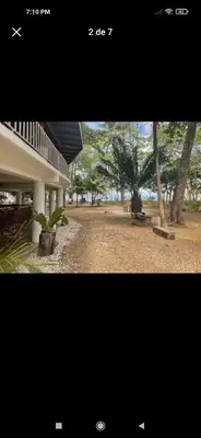 a picture of a building and a park with trees at Ocean View Tambor in Tambor