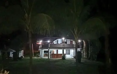 a house with lights on top of it at night at Ocean View Tambor in Tambor