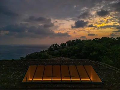 a view of the ocean from the roof of a building at Casa Bella Vina - by Pura Villas in Dominical