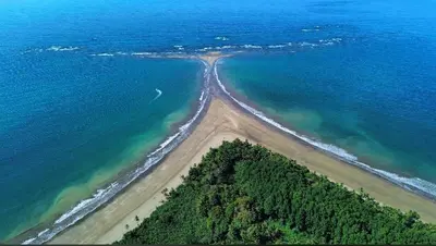 an aerial view of an island in the ocean at Villas BRENES in Uvita