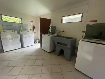 a laundry room with washing machines and a toilet at Samara Beach Las Palmeras Condo with Ocean view in Sámara