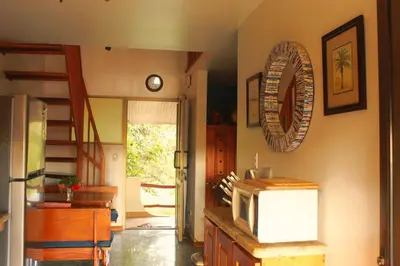 a kitchen with a microwave sitting on a counter at Samara Beach Las Palmeras Condo with Ocean view in Sámara