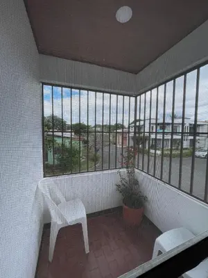 a balcony with a chair and a view of the ocean at Hospedaje Casa Mar in Liberia