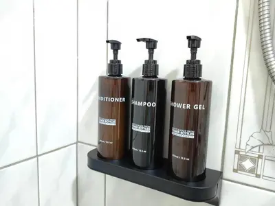 three oxygen bottles on a shelf in a bathroom at Hotel Boutique CasAguacate close to Airport, Pedregal, Centro de Convenciones de Costa Rica in Potrerillos