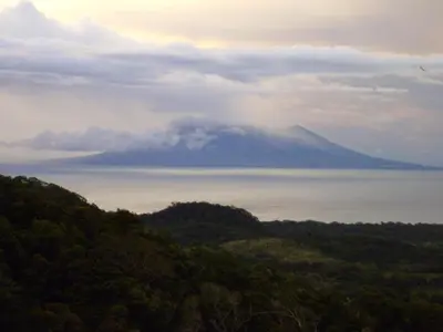 a view of a mountain over the water at Tierra Madre Eco Lodge in Los Andes