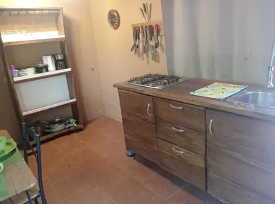 a kitchen with a stove and a sink in it at Fruta mango # 3 in Playa Guacalillo