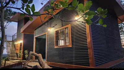 a house with a window and lights on it at Fruta mango # 3 in Playa Guacalillo