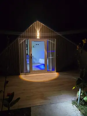 a room with a large glass door in a house at Pacific Glamp in Potrero