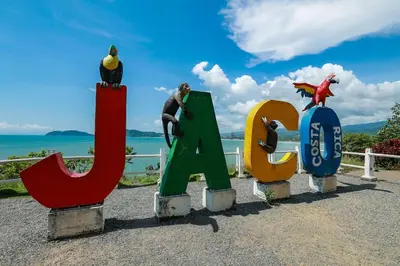 a group of signs that spell out the word sidx at . 5 min Walking Beach Jaco Apartment in Jacó
