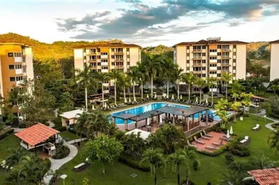 an aerial view of a resort with a swimming pool at . 5 min Walking Beach Jaco Apartment in Jacó