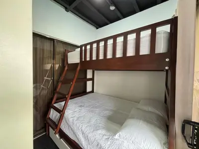 a couple of bunk beds in a room at Casa Arenas in Herradura