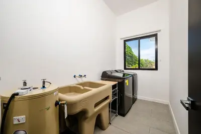 a bathroom with a sink and a window at .Lujosa casa en Hacienda Pinilla in Tamarindo