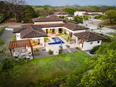 an aerial view of a house with a swimming pool at .Lujosa casa en Hacienda Pinilla in Tamarindo