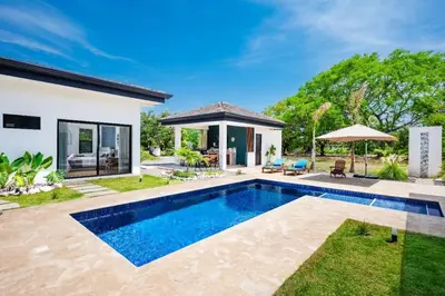 a swimming pool in the backyard of a house at .Lujosa casa en Hacienda Pinilla in Tamarindo