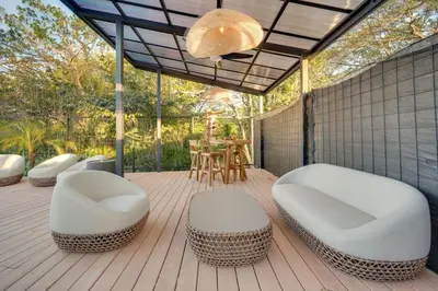 a patio with two white chairs and a table at The Bungalows #5 - Boutique Hotel in Flamingo Beach - Ground Level Studio in Playa Flamingo