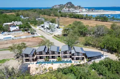 an aerial view of a house with a beach at The Bungalows #2 - Boutique Hotel in Flamingo Beach - Top Level Studio in Playa Flamingo