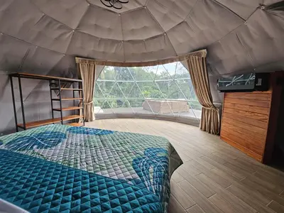 a bedroom with a bed and a large window at Moonlight 02 in Fortuna