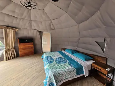 a bedroom with a bed in a tent at Moonlight 02 in Fortuna