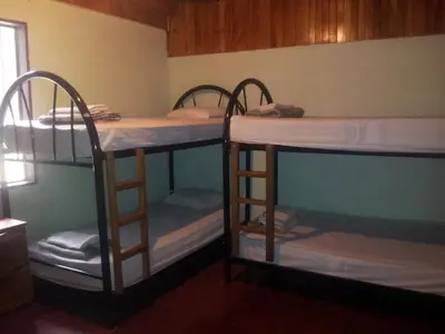 a group of bunk beds in a room at Hostel Monteverde Backpackers in Monteverde Costa Rica