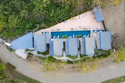 an overhead view of a house with solar panels on it at The Bungalows #1 - Boutique Hotel in Flamingo Beach - Ground Level Studio in Playa Flamingo