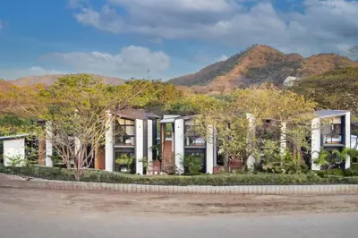 a rendering of a house with mountains in the background at The Bungalows #1 - Boutique Hotel in Flamingo Beach - Ground Level Studio in Playa Flamingo